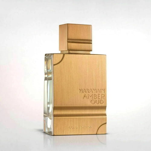 Close-up of Al Haramain Amber Oud Gold Edition bottle, highlighting its sophisticated gold metallic finish.