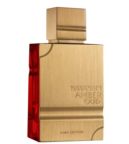 A close-up view of Al Haramain Amber Oud Ruby Edition bottle, showcasing its elegant gold finish and striking ruby red detail.