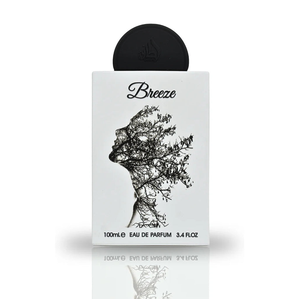 A close-up view of the Breeze Eau De Parfum bottle by Lattafa Pride, featuring an artistic design of a silhouette intertwined with branches on a sleek white surface.