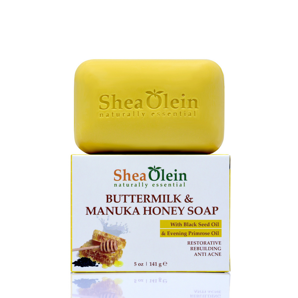 Shea Olein Buttermilk & Manuka Honey Soap bar displayed on its box, showcasing ingredients like Black Seed Oil and Evening Primrose Oil for radiant, blemish-free skin.