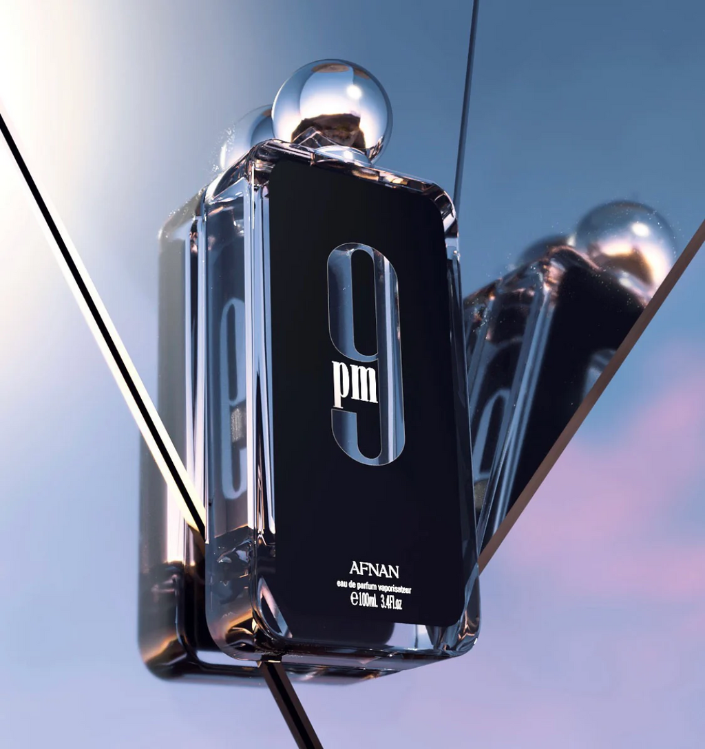 Afnan 9pm Perfume displayed against reflective mirrors - Sleek and modern unisex fragrance.