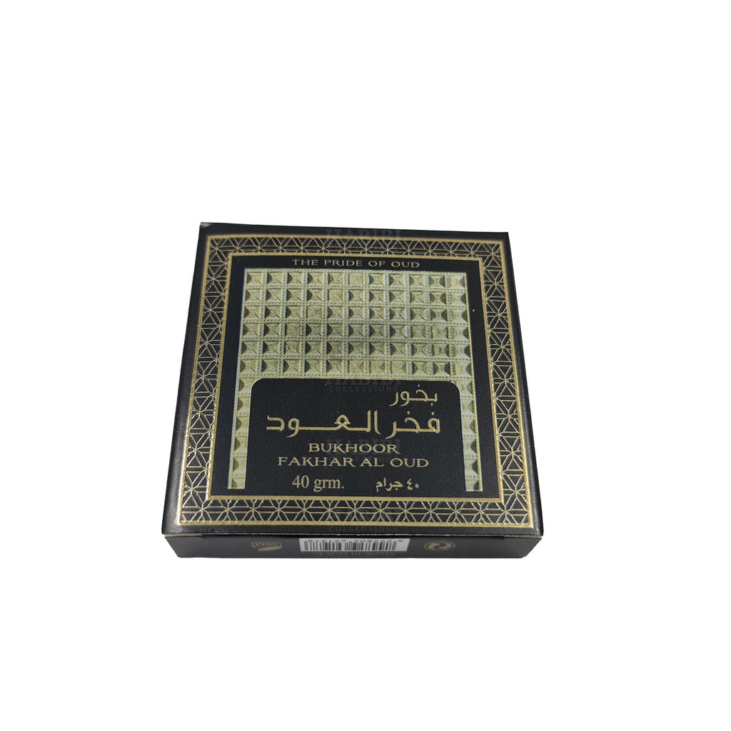 Bukhoor Fakhar Al Oud by Ard Al Zaafaran, a premium 40g Arabian incense featuring a rich oud fragrance, displayed in an elegant black and gold packaging with geometric patterns.